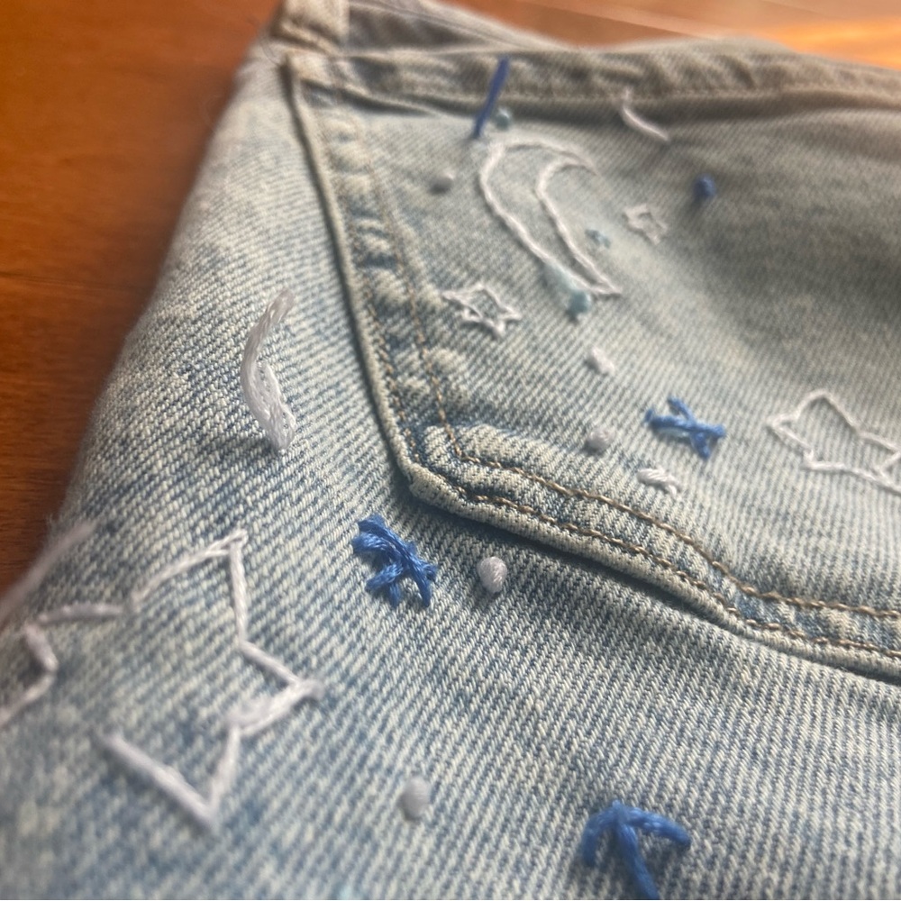 SO size 11/30w hand embroidered ripped jeans, medium wash wide leg